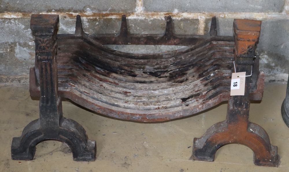 A cast iron fire grate with dogs, W.70cm, D.40cm, H.40cm